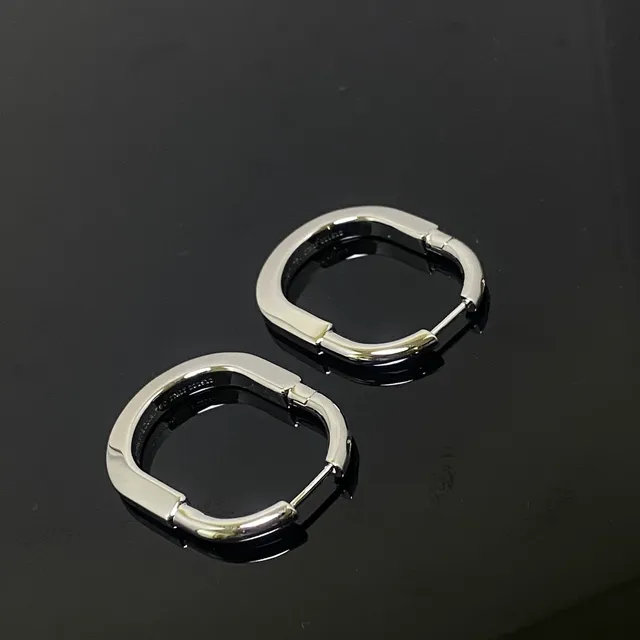 Two-Tone Gold and Silver Hinged Oval Hoop Earrings 3