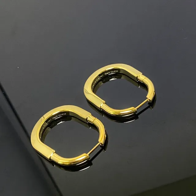 Two-Tone Gold and Silver Hinged Oval Hoop Earrings 4