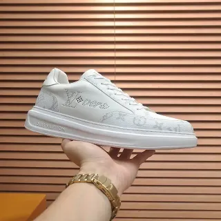 Louis Vuitton LV Trainer blanco gris Monogram recubierto cuero perforado Logo lifestyle zapatillas