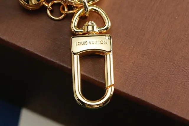 Louis Vuitton Raquete de Tênis Chaveiro Dourado Marrom Metal Acessório para celular 3