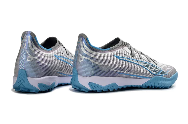 Puma Future Z Chaussures de football gris bleu avec upper en tricot, overlay de vague asimétrique pour turf 5