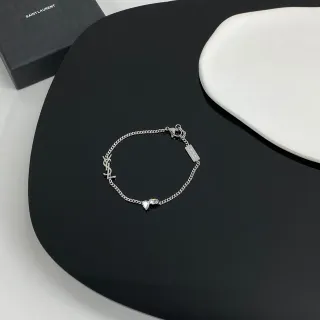 سوار سان لوران مونوغرام فضي سلسلة كيرب شفاف متشابك YSL