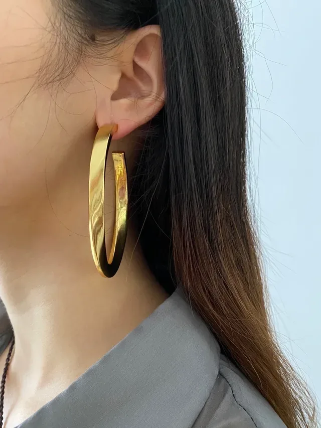 Saint Laurent Boucles d'oreilles aro twist or poli 2