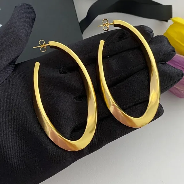 Saint Laurent Boucles d'oreilles aro twist or poli 6