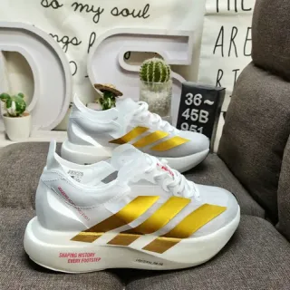 Adidas White and Gold Three-Stripe Running Shoes