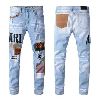 Amiri Patchwork Distressed Logo Jeans
