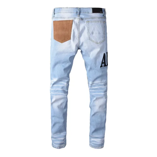 Amiri Patchwork Distressed Logo Jeans 2
