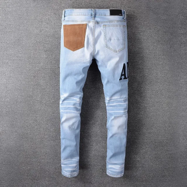 Amiri Patchwork Distressed Logo Jeans 3