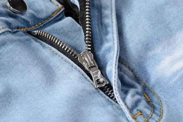 Amiri Patchwork Distressed Logo Jeans 4