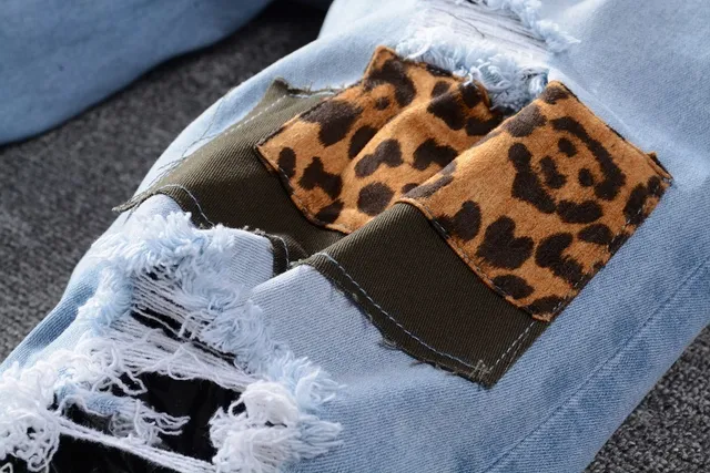 Amiri Patchwork Distressed Logo Jeans 8