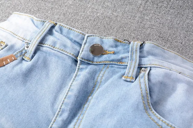 Amiri Patchwork Distressed Logo Jeans 9