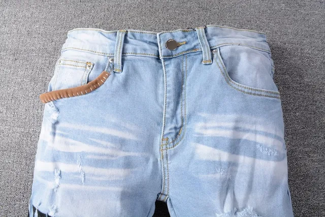Amiri Patchwork Distressed Logo Jeans 10