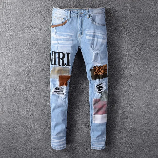 Amiri Patchwork Distressed Logo Jeans 12