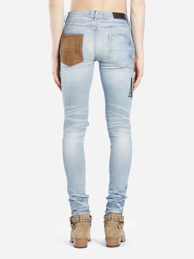 Amiri Patchwork Distressed Logo Jeans 15
