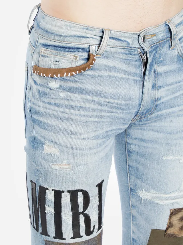 Amiri Patchwork Distressed Logo Jeans 17