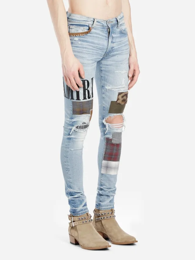 Amiri Patchwork Distressed Logo Jeans 18