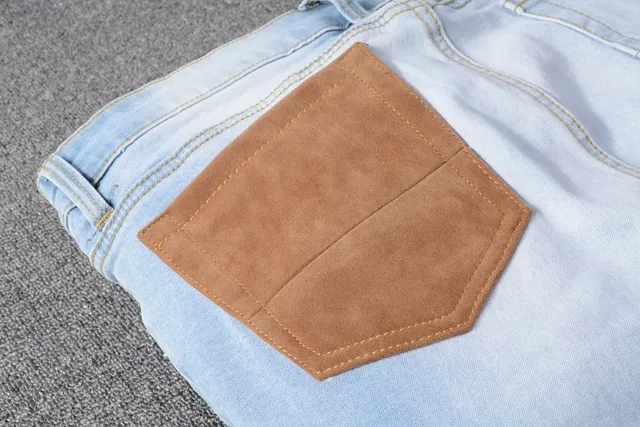 Amiri Patchwork Distressed Logo Jeans 21