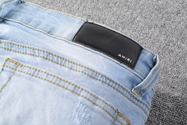 Amiri Patchwork Distressed Logo Jeans 22