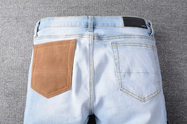 Amiri Patchwork Distressed Logo Jeans 23