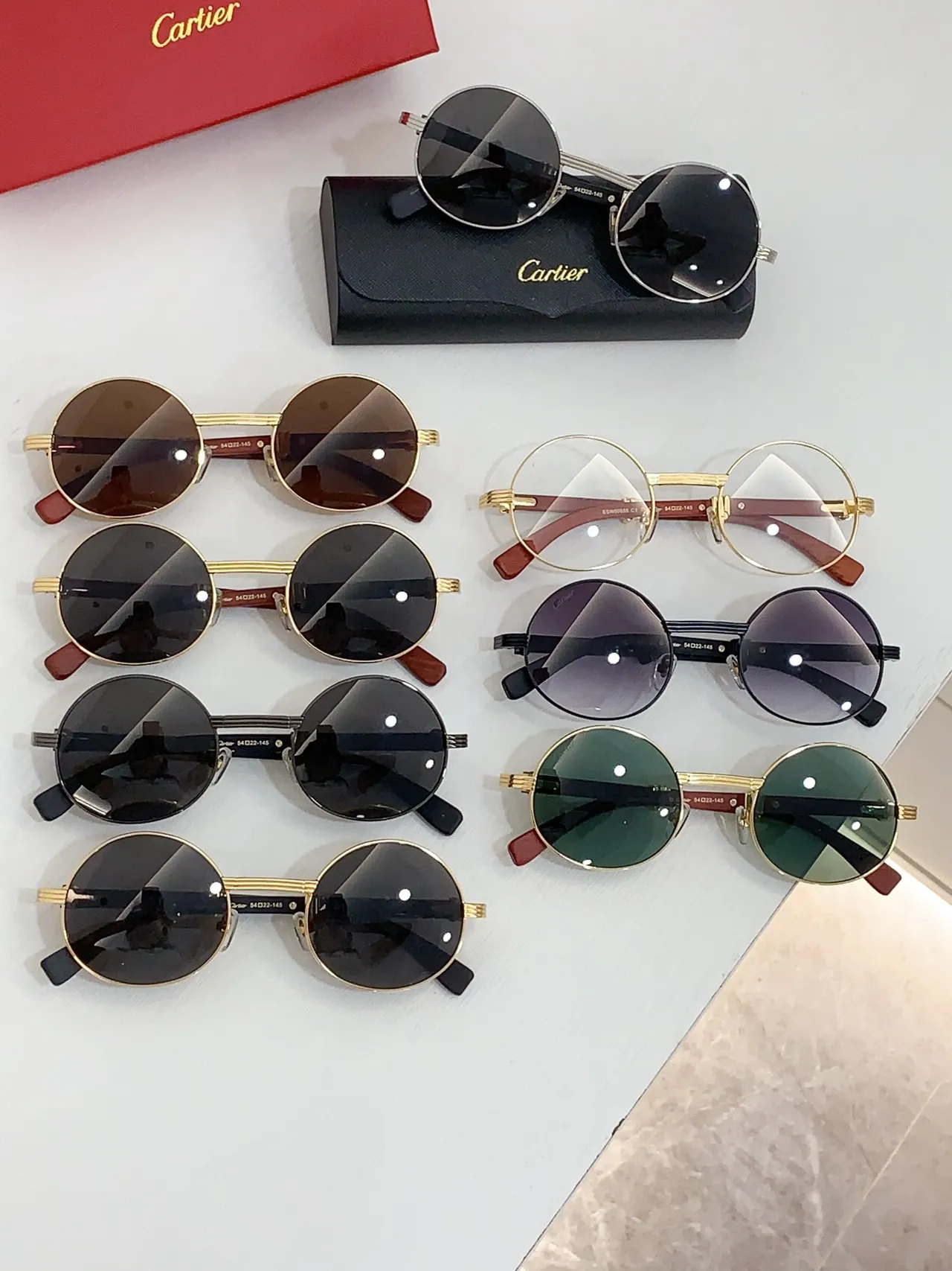 Cartier نظارات شمسية مدورة ذهبية وبنية أسيتات 2