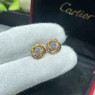Cartier Swirling Dual-Tone Gold Stud Earrings