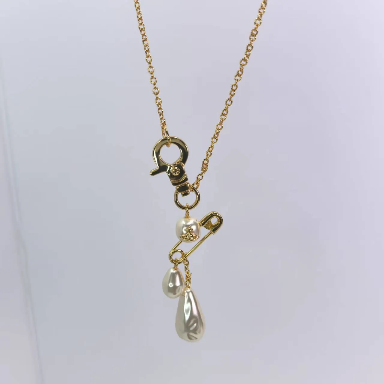 Gold-Tone and Silver-Tone Safety Pin Baroque Pearl Drop Necklaces 2