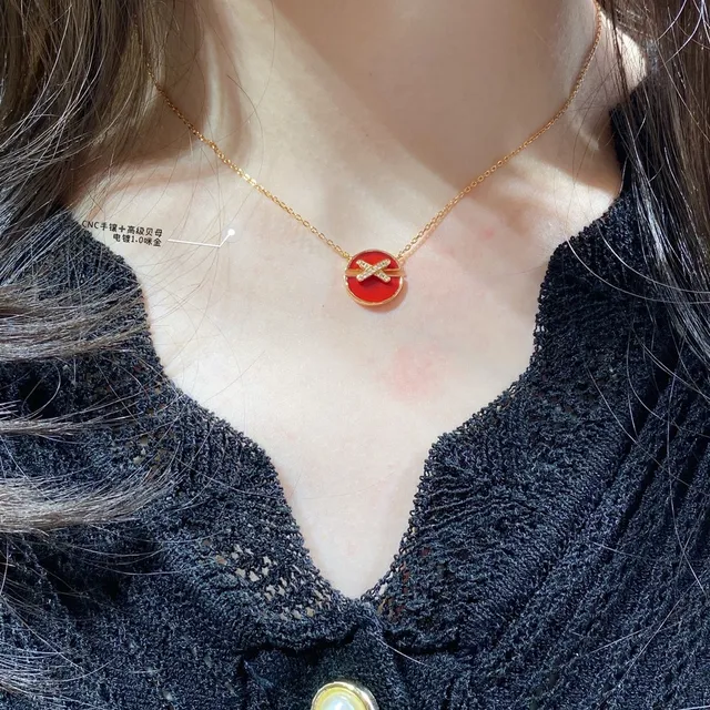 Collier X-Bar avec perle mère de ton doré 8