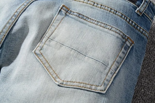 Light-Wash Distressed Ripped Slim-Fit Jeans 11