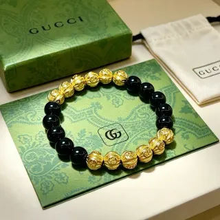 Gucci سوار أسود ذهبي خرز