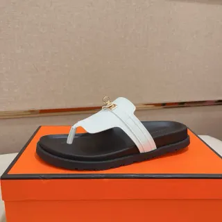 Hermès Oran Sandal White Black Leather T-Strap Gold-Tone H-Link Hardware Slippers