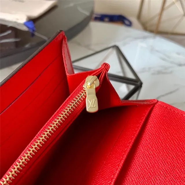 Louis Vuitton Monogram Canvas billetera larga con flap 23