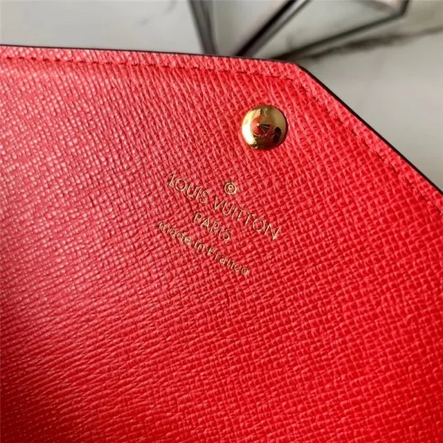 Louis Vuitton Monogram Canvas billetera larga con flap 24