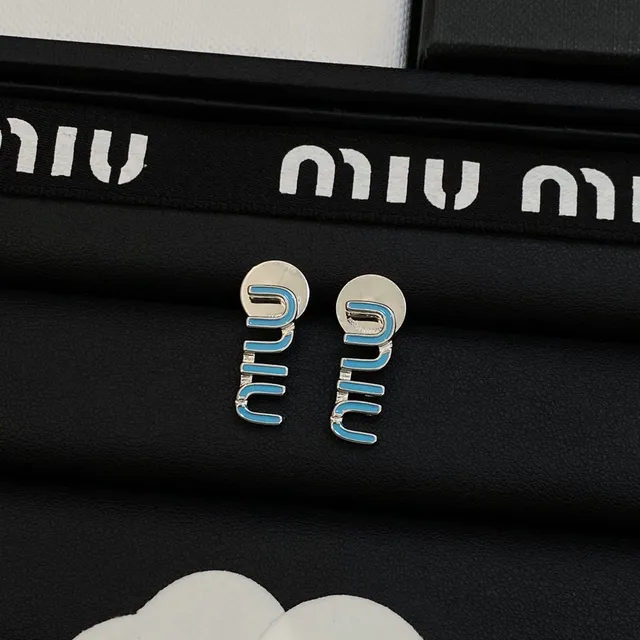 Miu Miu Boucles d'oreilles avec motif logo en émail bleu doré 5