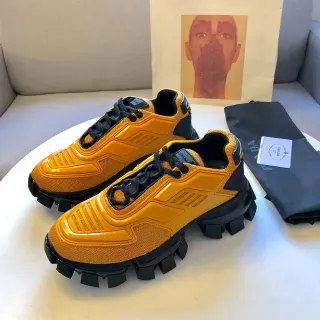 Prada Cloudbust أحذية رياضية برتقالية وأسود كثيفة