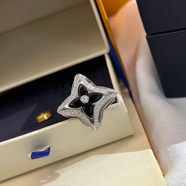 Tiffany & Co. Silver Blue Openwork Star Motif Polished Metal Ring 5