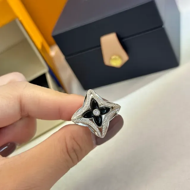 Tiffany & Co. Silver Blue Openwork Star Motif Polished Metal Ring 7