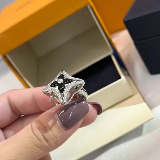 Tiffany & Co. Silver Blue Openwork Star Motif Polished Metal Ring 8