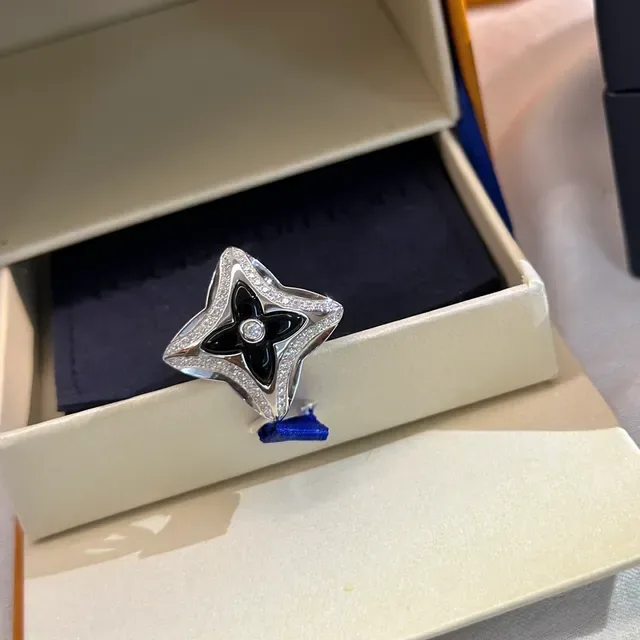 Tiffany & Co. Silver Blue Openwork Star Motif Polished Metal Ring 9