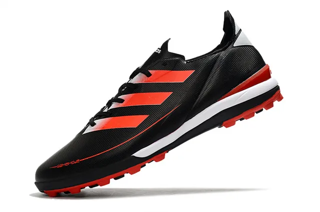 Adidas Chaussures de football orange et noir, upper synthétique, lacets asymétriques, low-cut pour gazon artificiel 17