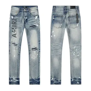 Amiri Jeans Distressed com Logo Impresso em Azul Claro com Salpicadura de Tinta Slim Fit