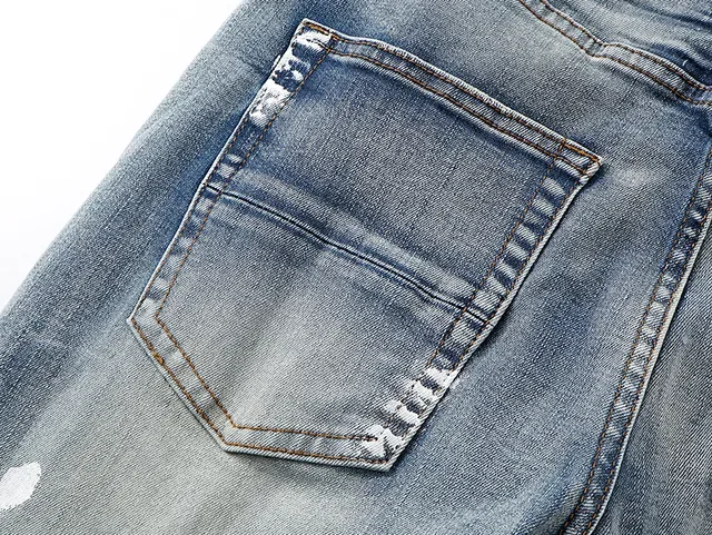 Amiri Distressed Logo-Print Light Blue Paint-Splatter Slim-Fit Jeans 8