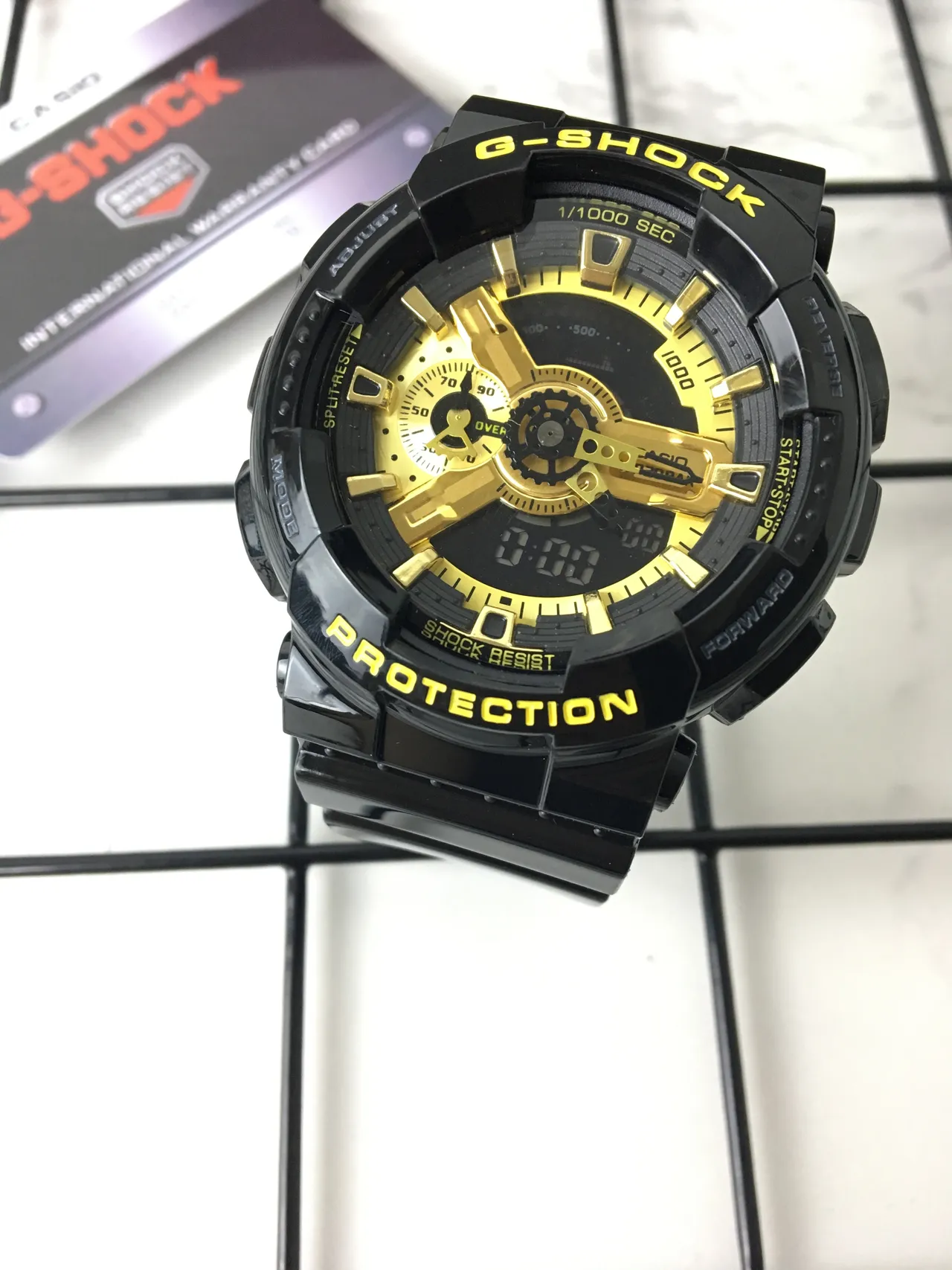 Casio G-Shock GA-100 Montre sportive noire et or 2