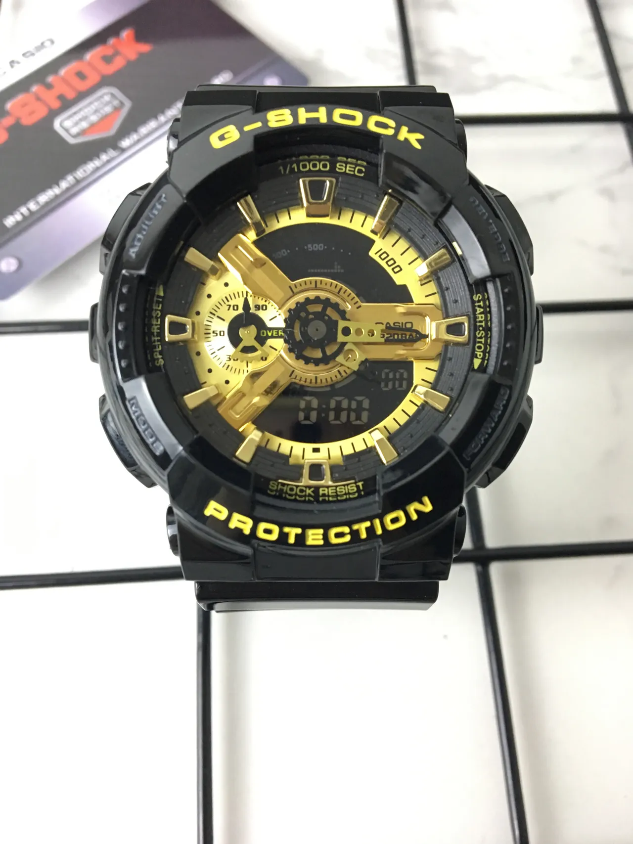Casio G-Shock GA-100 Montre sportive noire et or 3