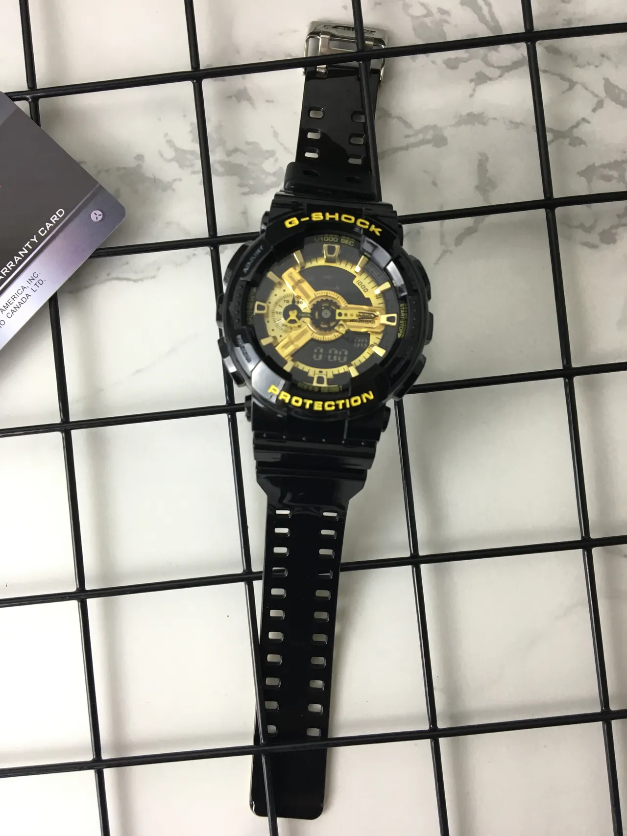 Casio G-Shock GA-100 Montre sportive noire et or 6