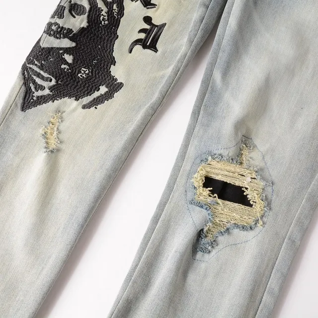 Distressed Light-Wash Graphic-Print Slim-Fit Jeans 17