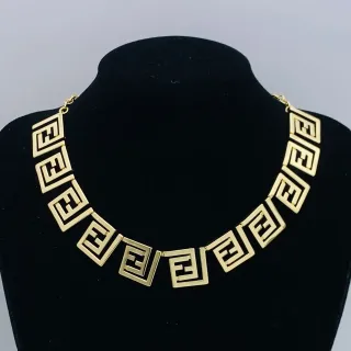 Collier choker motif géométrique de clé grecque en ton doré
