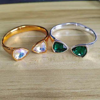 Pulseras abiertas con piedra en forma de lágrima en tono dorado y plateado