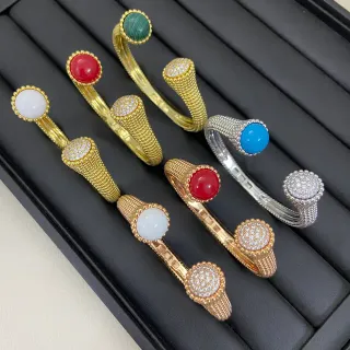 Brazaletes Abiertos de Oro y Plata con Bandas de Malla Texturizadas