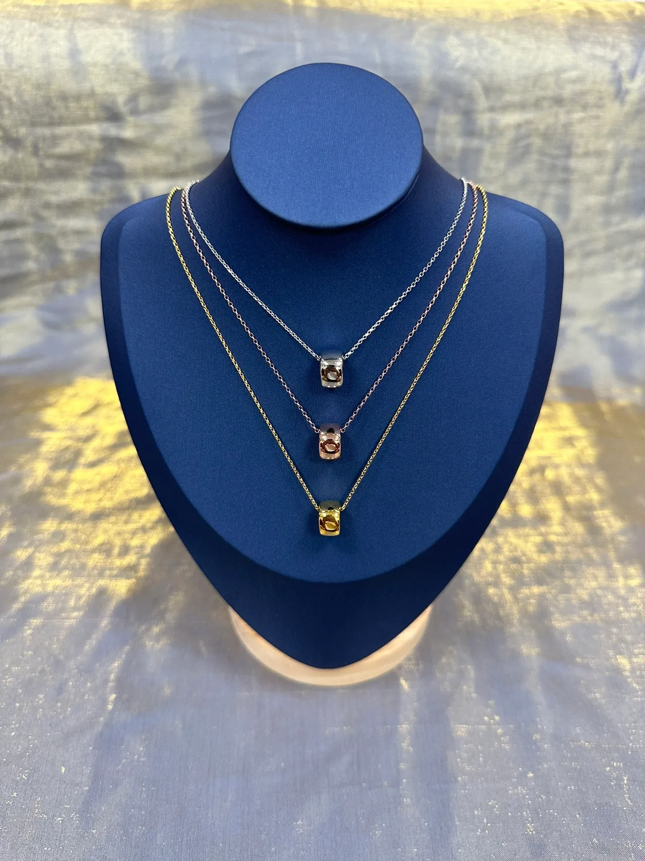 Gold-Tone Geometric Cube Pendant Necklace 9