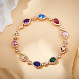 Pulsera Halo en tono dorado con gemas multicolores en forma de pera y diamantes Pavé